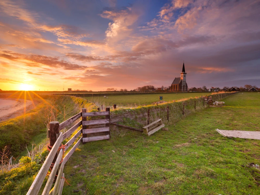 The church of Den Hoorn on the island of Texel in The Netherlands at sunrise.