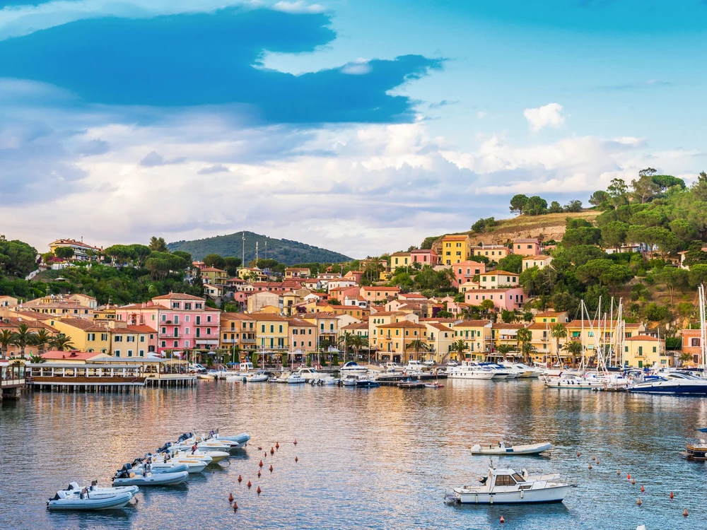 Panoramic view over the famous town Porto Azzurro at sunset, in Elba island, Italy