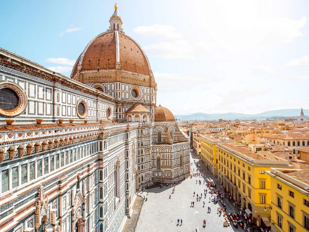 Top cityscape view on the dome of Santa Maria del Fiore church and old town in Florence