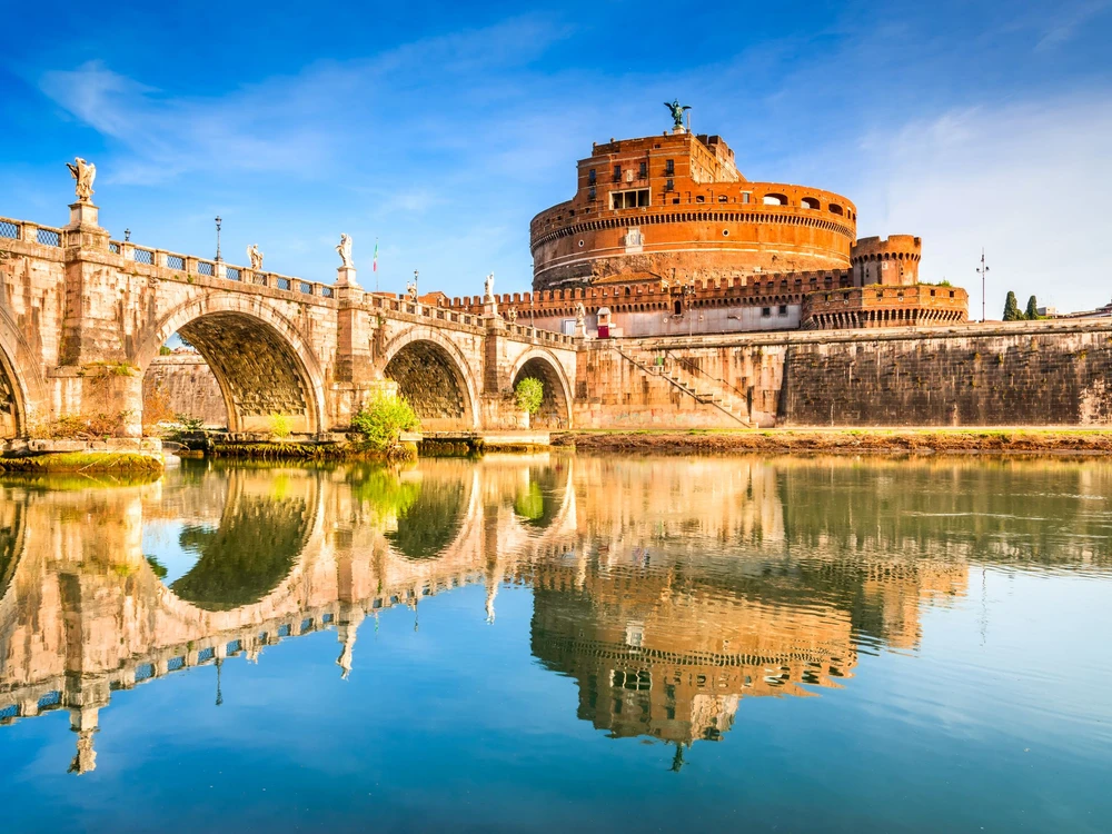 Rome, Italy. Bridge and Castel Sant Angelo and Tiber River. Built by Hadrian emperor as mausoleum in 123AD, ancient Roman Empire landmark. Vatican.