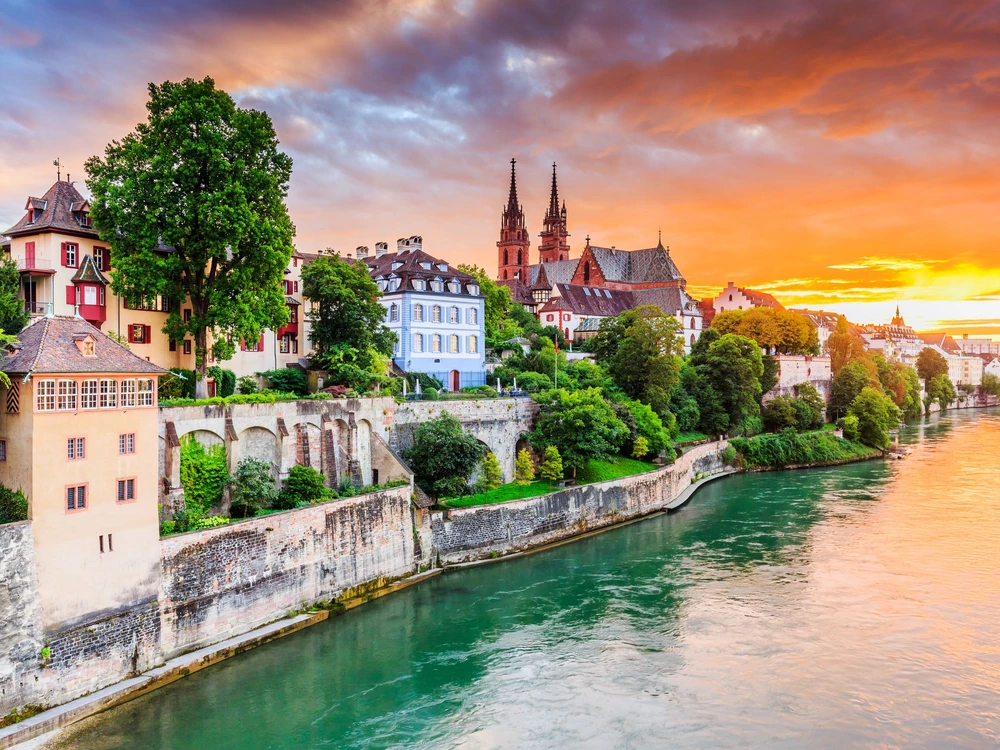Basel, Switzerland. Old town with red stone Munster cathedral on the Rhine river.