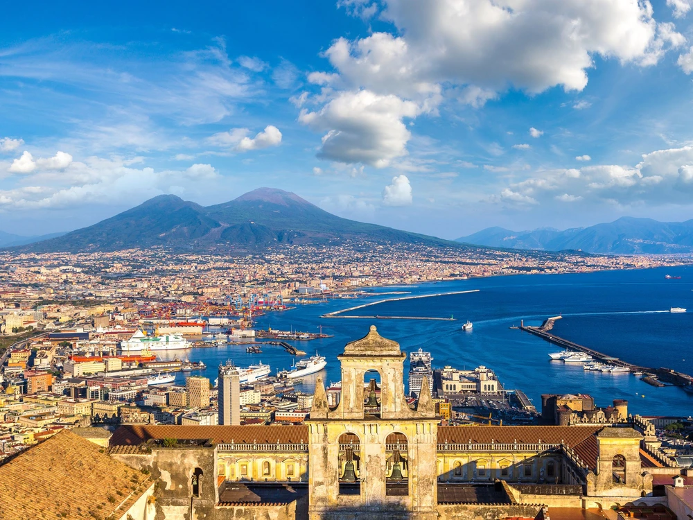 Napoli (Naples) and mount Vesuvius in the background at sunset in a summer day, Italy, Campania