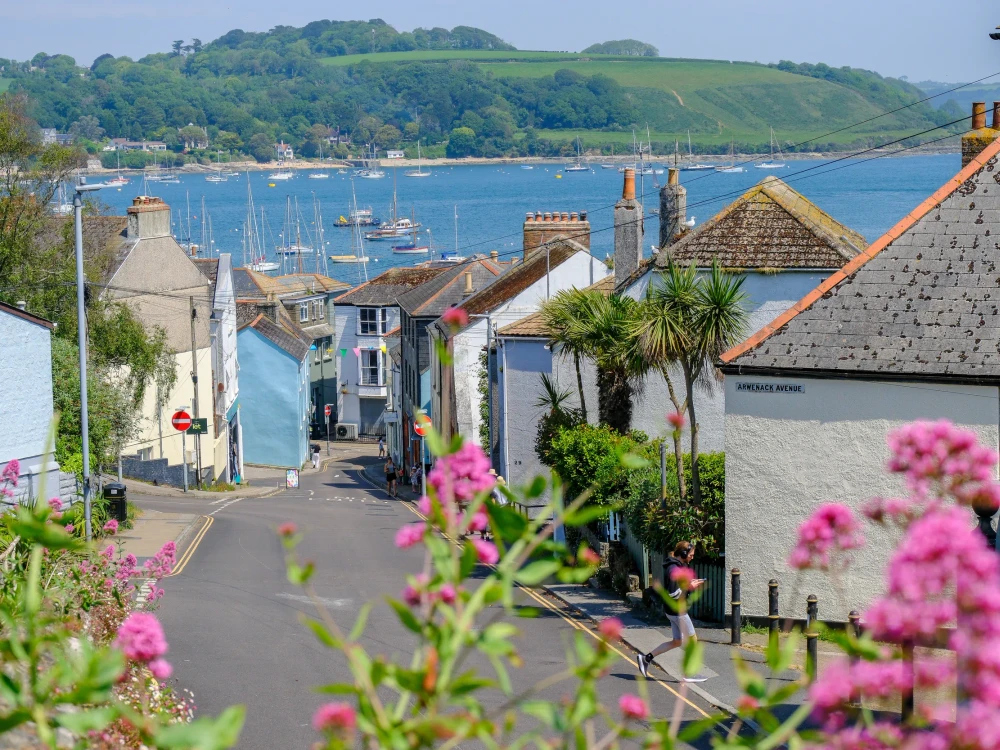 27 MAY 2026 - Falmouth, UK - A view down through Falmouth to the bay with boats moored on a summers day.