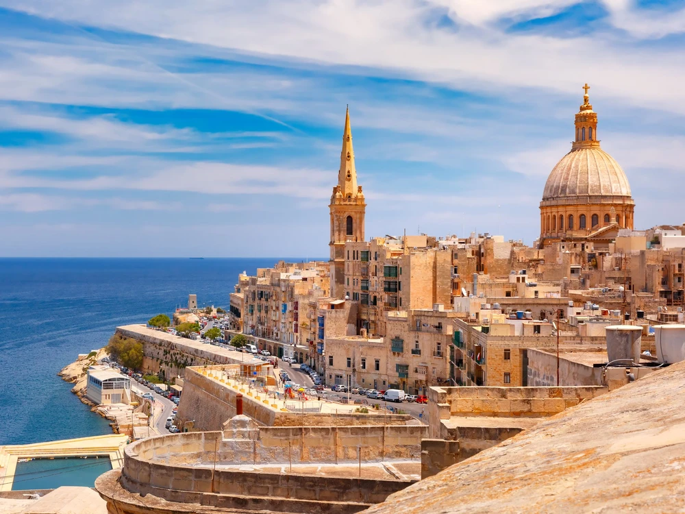 View from above of roofs and church of Our Lady of Mount Carmel and St. Paul's Anglican Pro-Cathedral, Valletta, Capital city of Malta