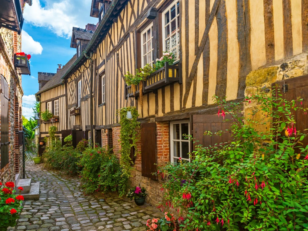 old cozy street with historic half timbered buildings in the the beautiful town of Honfleur, France with nobody