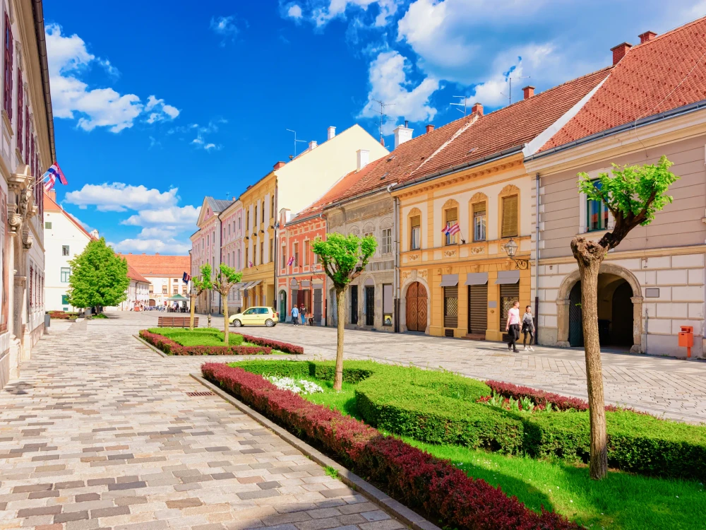 Street in Old city in Varazdin in Croatia. Cityscape with tourists in famous Croatian town in Europe in summer