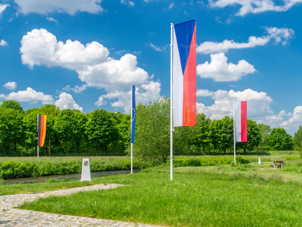 Flags of Czech Republic, Germany, Europe Union and Poland in Sudetes on border of three countries.