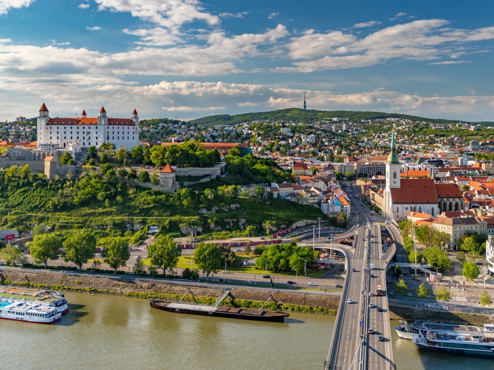 A picture of the landmarks of Bratislava: St. Martin's Cathedral, the Bratislava Castle and the Bridge SNP.