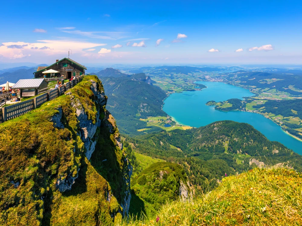 Amazing view from Schafberg by St. Sankt Wolfgang im in Salzkammergut, Haus house Schafbergspitze, lake Mondsee, Moonlake. Blue sky, alps mountains. Upper Austria, Salzburg, near Wolfgangsee, Attersee