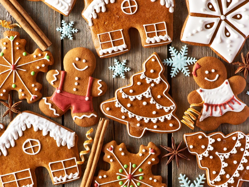 Christmas homemade gingerbread cookies on wooden table