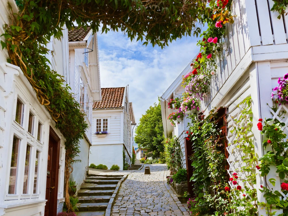 Street with white wooden houses in old centre of Stavanger - Norway - architecture background