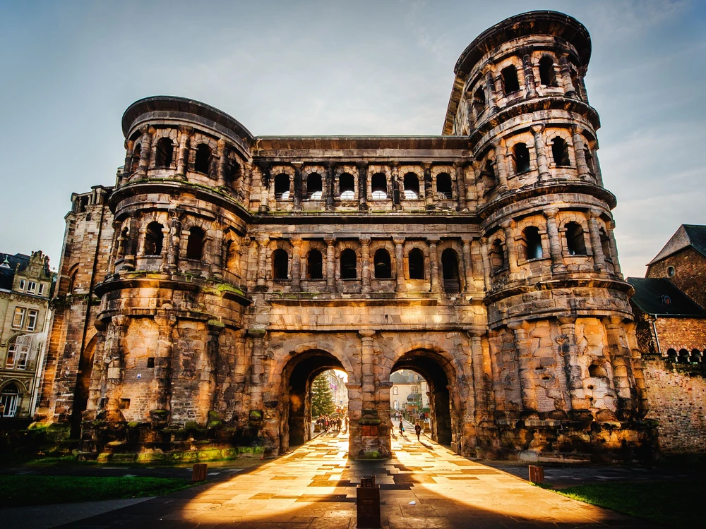 The Porta Nigra (Black Gate) in Trier city, Germany. It is a famous large Roman city gate. Front view. UNESCO World Heritage Site