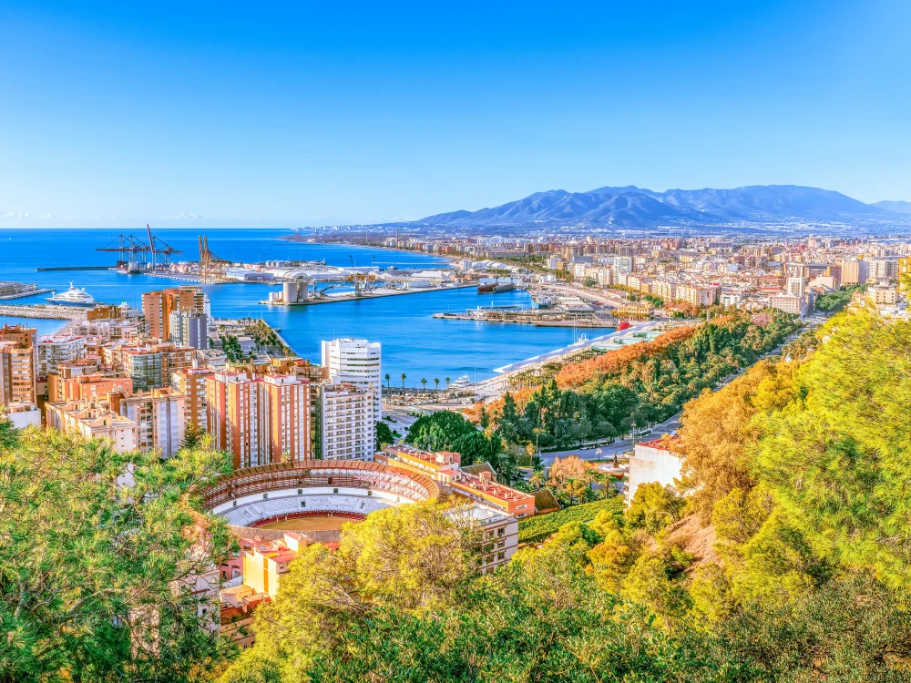 Malaga aerial cityscape, Costa del Sol, Andalusia, Spain - Sea cargo port in Mediterranean sea.