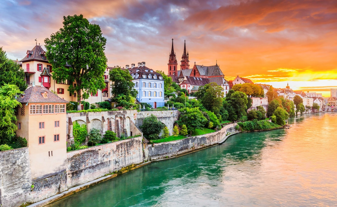 Basel, Switzerland. Old town with red stone Munster cathedral on the Rhine river.
