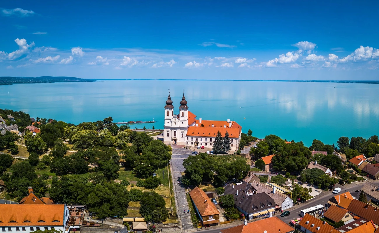 Tihany, Hungary - Aerial panoramic view of the famous Benedictine Monastery of Tihany (Tihany Abbey) with beautiful coloruful Lake Balaton at background