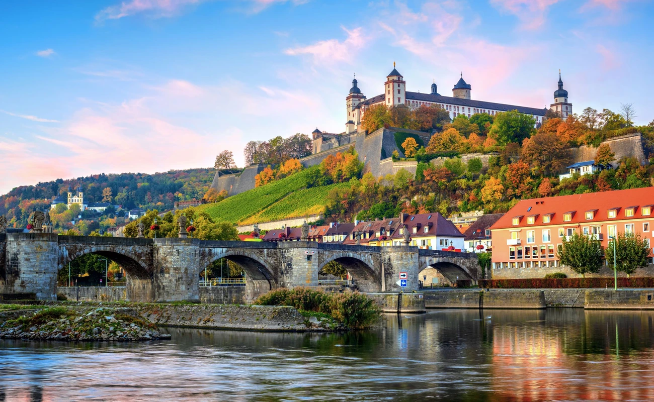 Wurzburg, Bavaria, Germany, view of the Marienberg Fortress and the Old Main Bridge on colorful sunrise