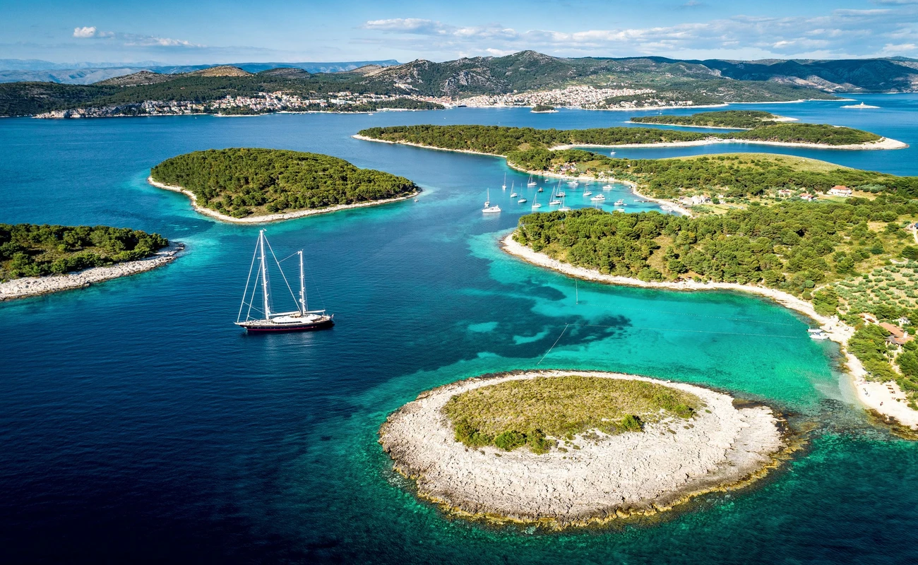 Aerial view of Paklinski Islands in Hvar, Croatia. Turquise water bays with luxury yachts and sailing boats. Toned image.