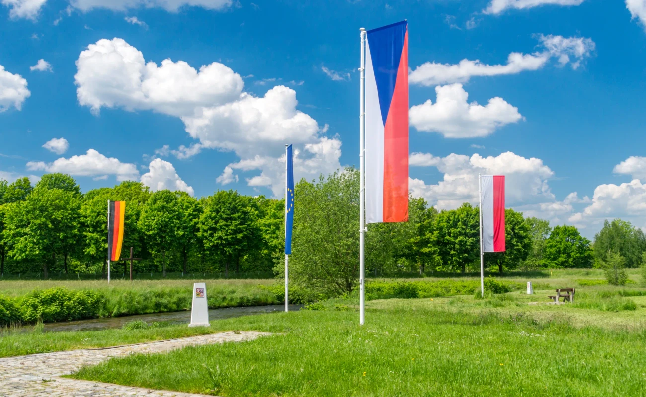 Flags of Czech Republic, Germany, Europe Union and Poland in Sudetes on border of three countries.