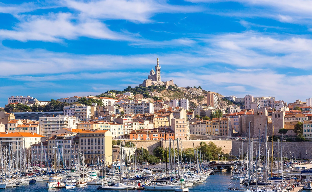 Aerial panoramic view on basilica of Notre Dame de la Garde and old port  in Marseille, France